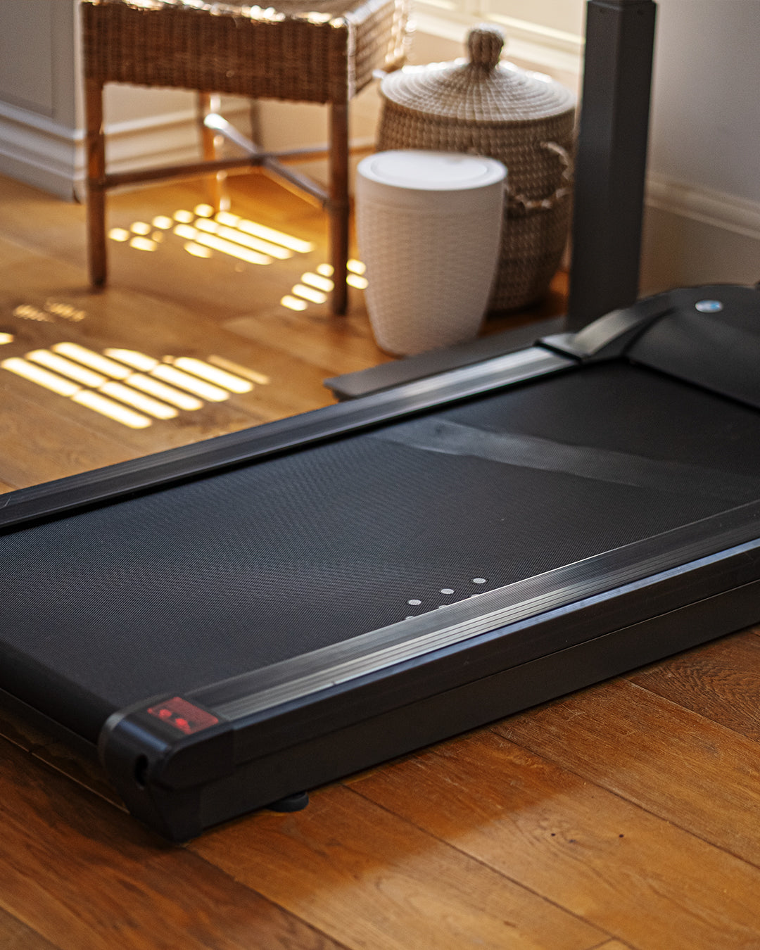 A Lifespan walking pad in a home office 