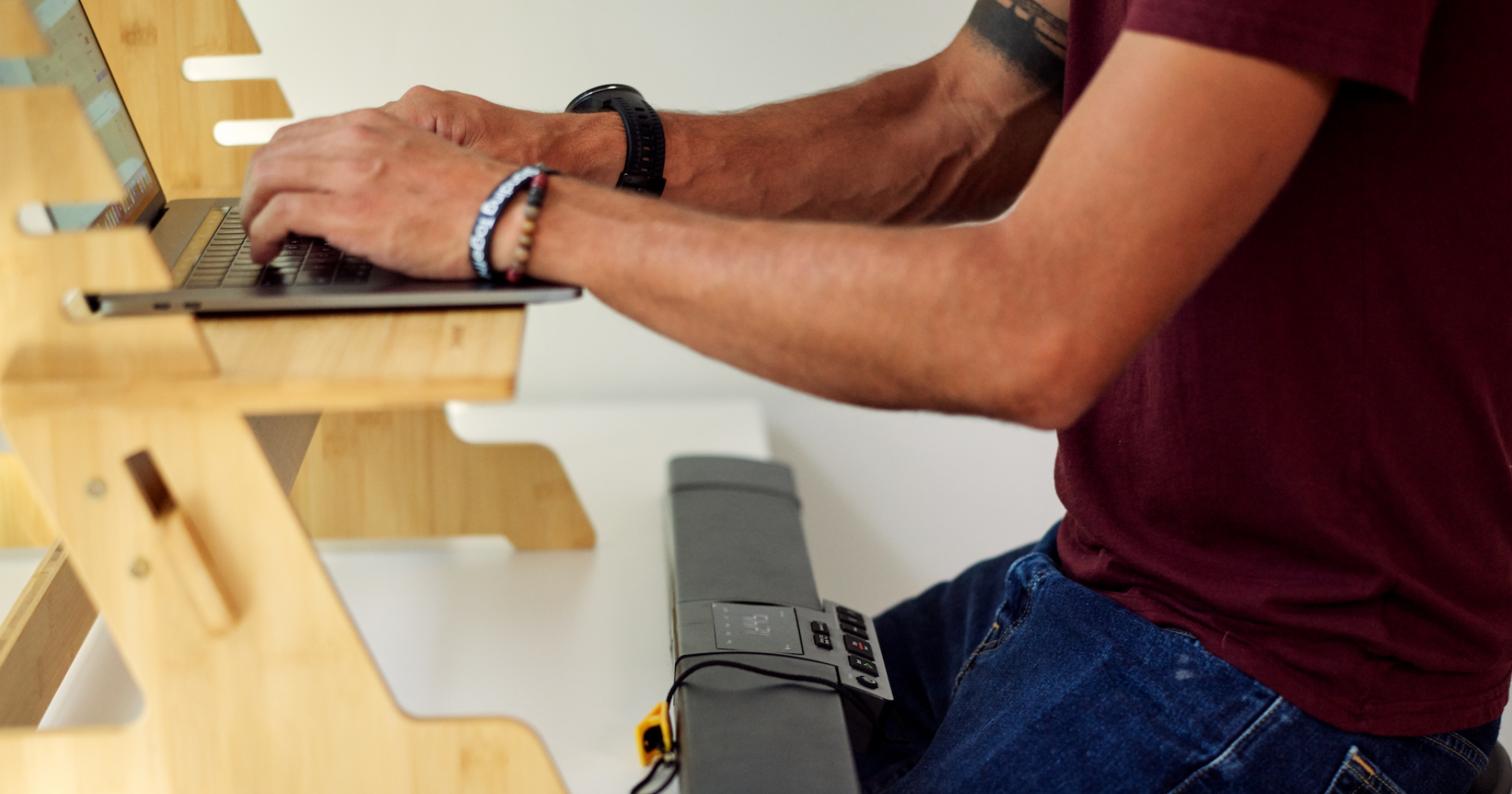 A man demonstrating the correct posture in his ergonomic workspace