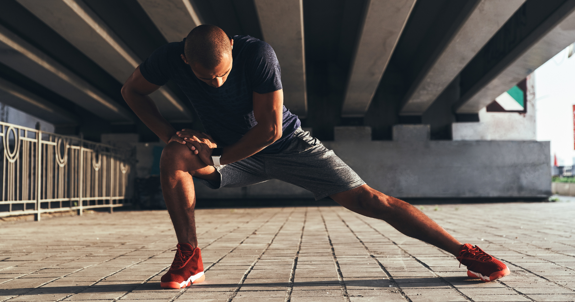 male holding a lateral lunge stretch