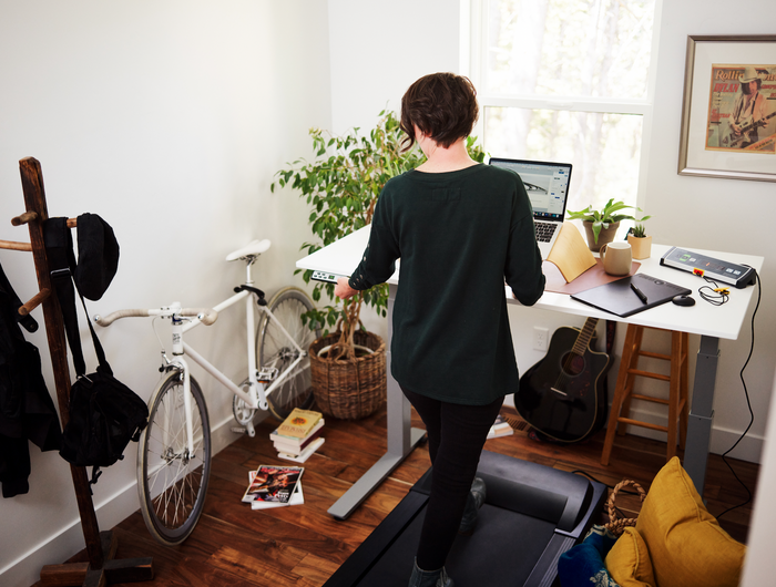 woman at desk walking pad uk